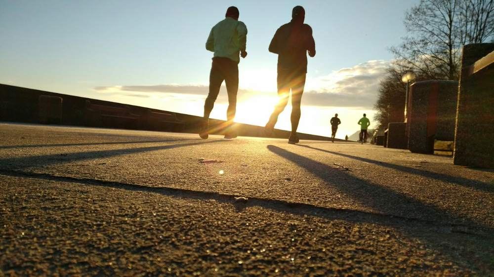 Two runners at sunrise