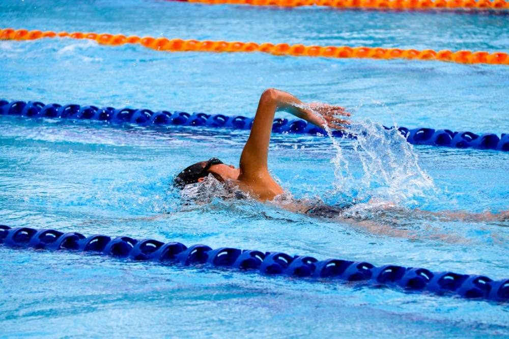 Swimmer doing front crawl in a pool